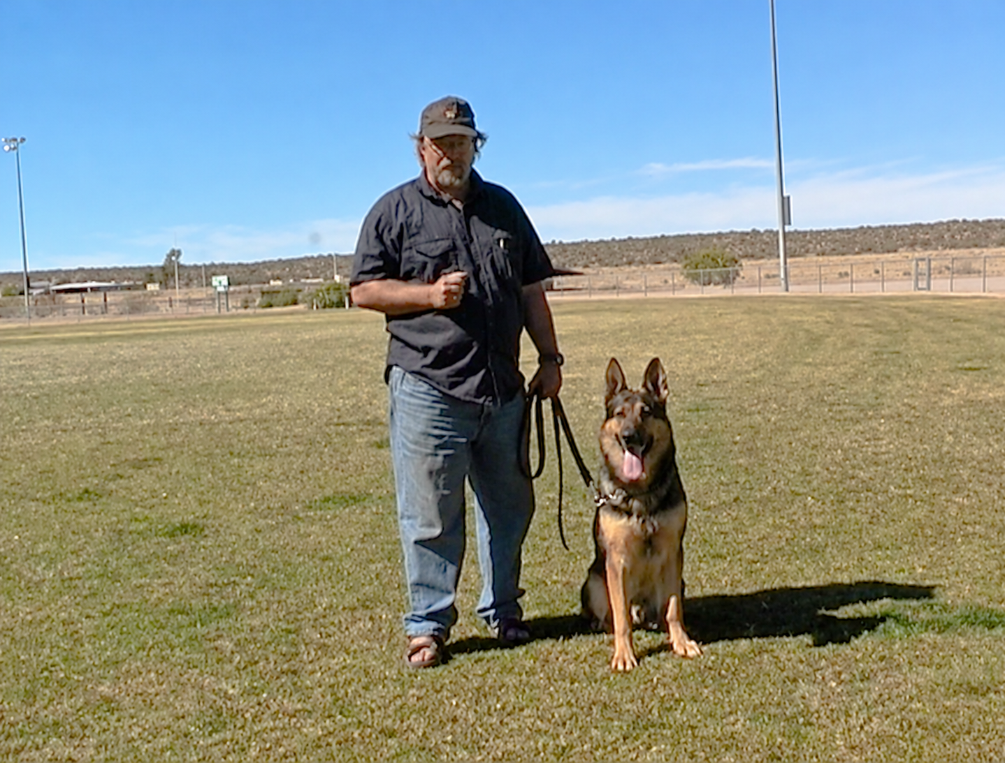 Hans with a German Shepherd on the training field